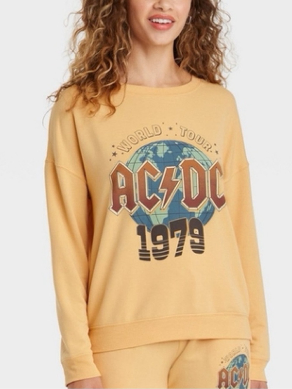 Mustard yellow AC/DC sweatshirt features a "World Tour 1979" graphic, size 3x